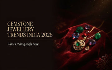 Gemstone jewellery trends India 2026 — natural coloured stones and gold pendant on red velvet