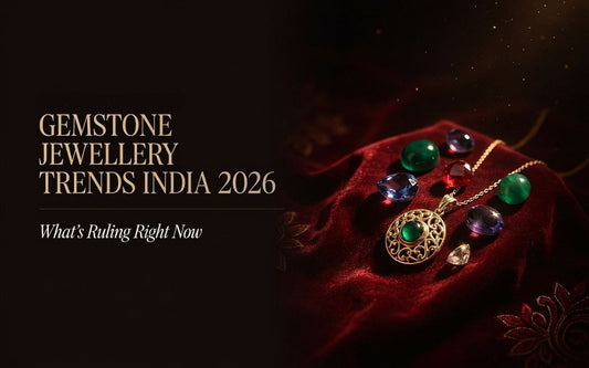 Gemstone jewellery trends India 2026 — natural coloured stones and gold pendant on red velvet