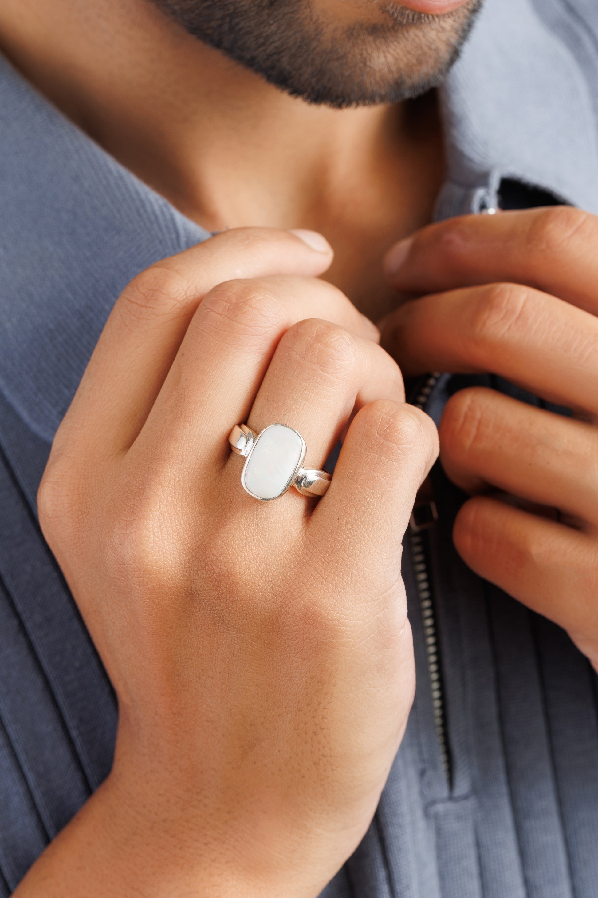 Opal ring on hand