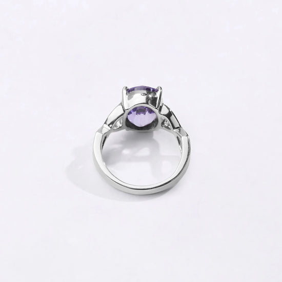 Powerful natural Alexandrite gemstone ring handcrafted in 925 sterling silver featuring a vibrant color-changing gemstone in an elegant Urja setting with a polished finish from Myra Gems.