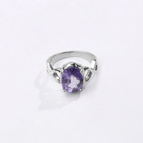 Powerful natural Alexandrite gemstone ring handcrafted in 925 sterling silver featuring a vibrant color-changing gemstone in an elegant Urja setting with a polished finish from Myra Gems.