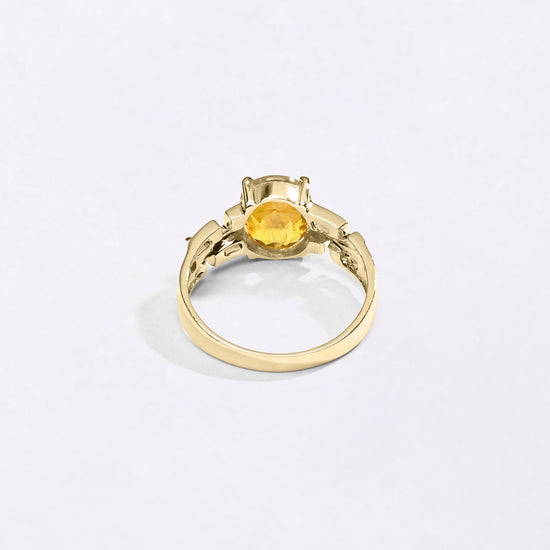 Swastik Yellow Sapphire Ring In 18K Gold from Myra Gems