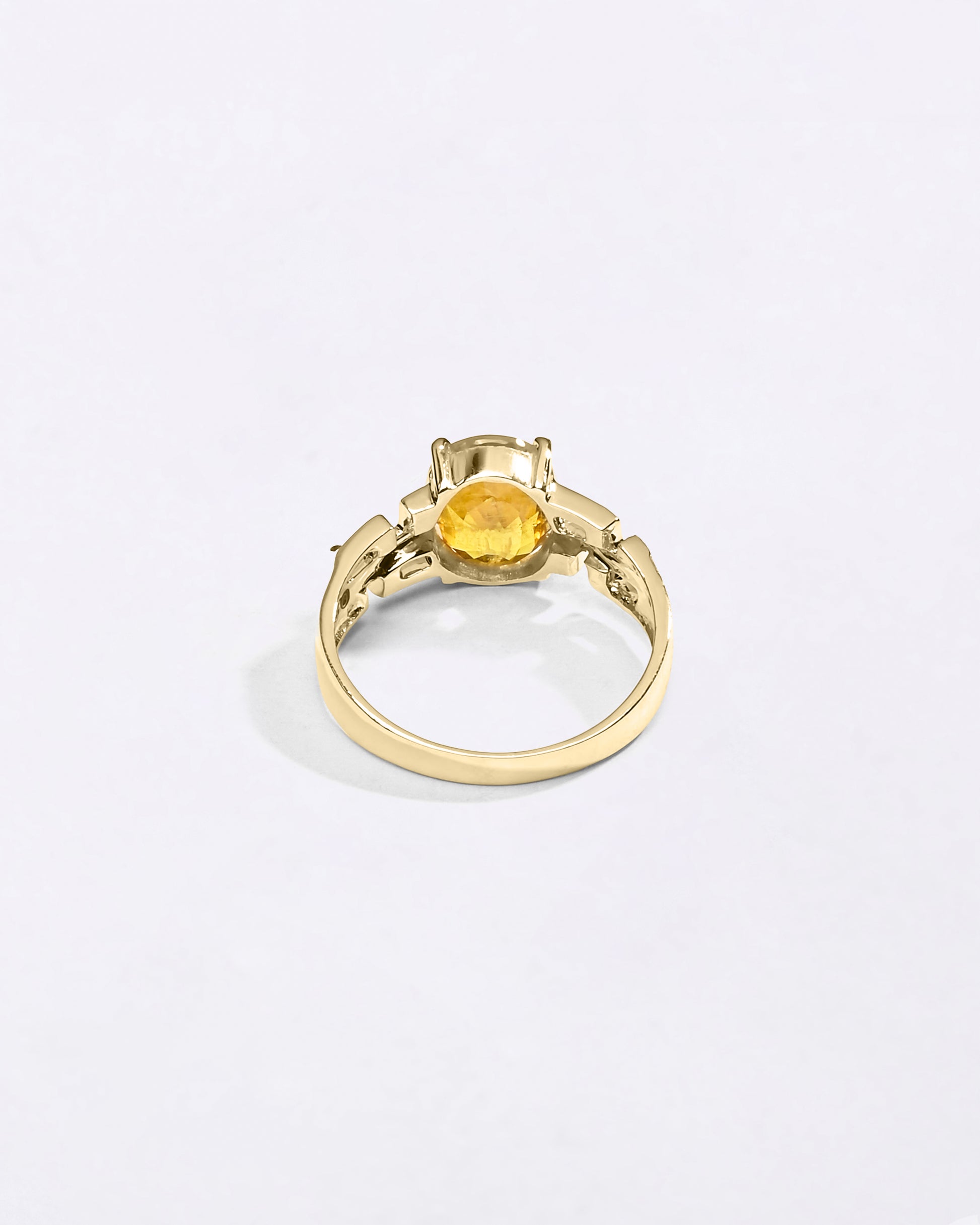 Swastik Yellow Sapphire Ring In 18K Gold from Myra Gems