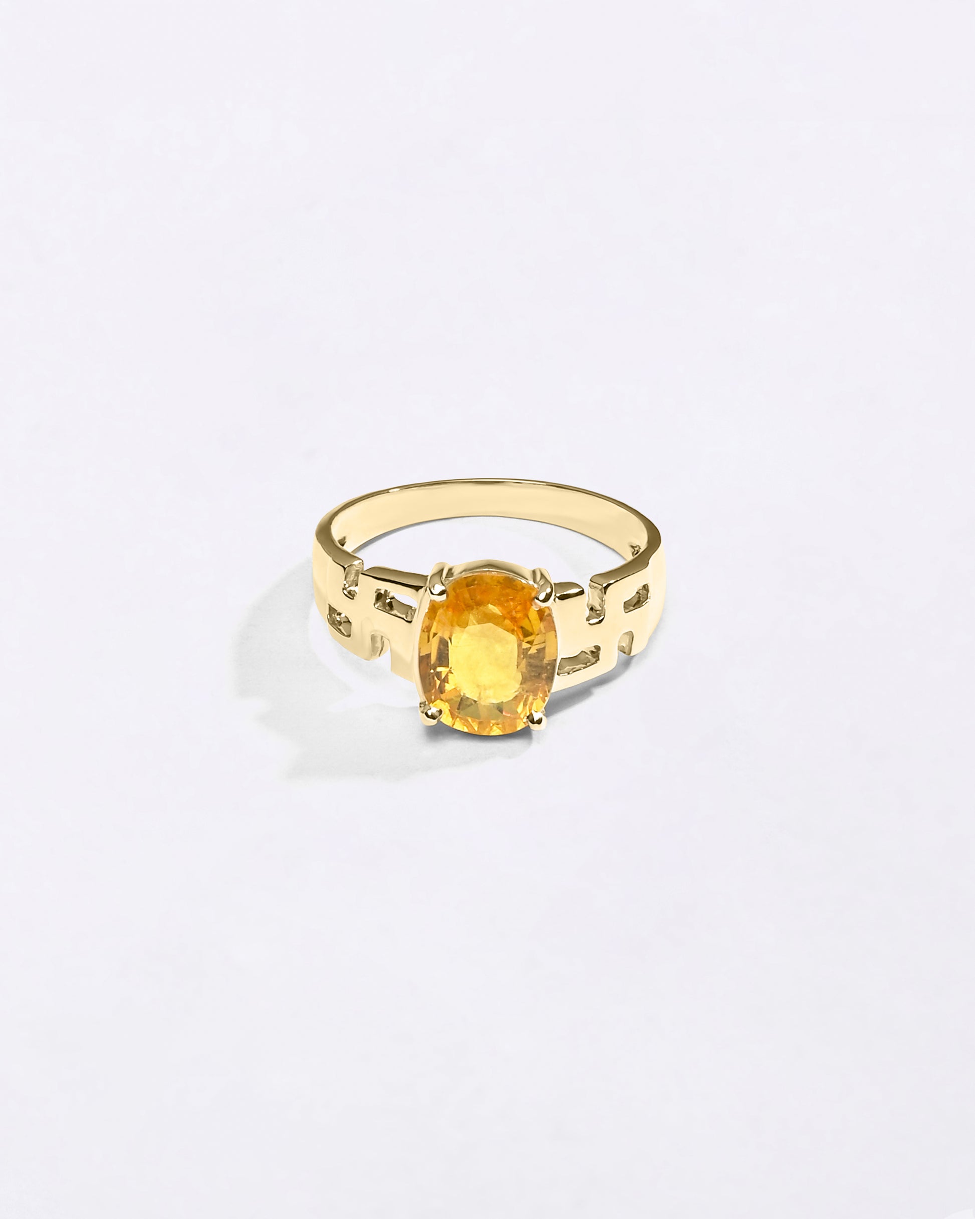 Swastik Yellow Sapphire Ring In 18K Gold from Myra Gems
